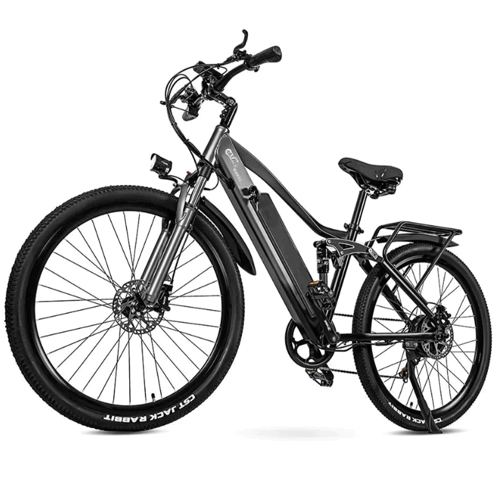 A gray electric trekking bike with off road tires and a step through frame.
